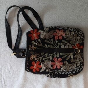 Embroidered floral black sling backpack